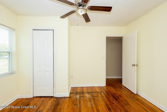 1108 Abington St, Cocoa, FL 32922 - unfurnished bedroom with wood finished floors, baseboards, a closet, and a ceiling fan