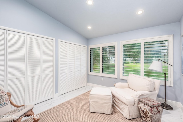 1510 Pioneer Dr, Melbourne, FL 32940 - living area featuring marble finish floors, recessed lighting, and lofted ceiling