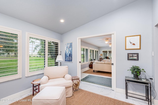 1510 Pioneer Dr, Melbourne, FL 32940 - living area with vaulted ceiling, marble finish floors, recessed lighting, and a ceiling fan
