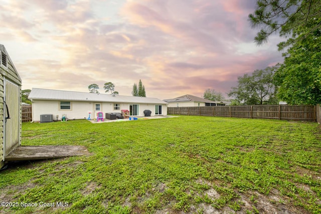 6485 Beard Ave, Cocoa, FL 32927 - view of yard with central AC unit and a patio area