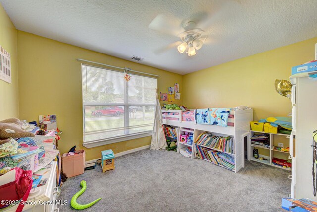 6485 Beard Ave, Cocoa, FL 32927 - recreation room with carpet, ceiling fan, and a textured ceiling