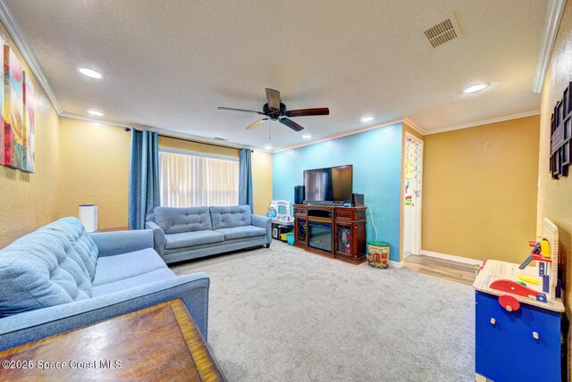 6485 Beard Ave, Cocoa, FL 32927 - living room with crown molding, a ceiling fan, recessed lighting, a textured ceiling, and baseboards