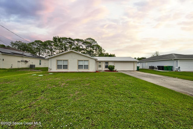 6485 Beard Ave, Cocoa, FL 32927 - ranch-style house featuring driveway, an attached garage, central AC unit, and a front lawn
