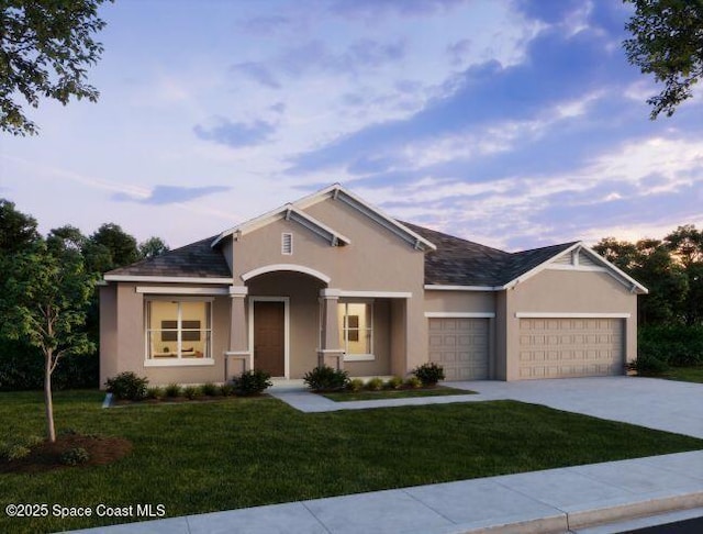 6305 Moonrise Dr, Merritt Island, FL 32953 - view of front of house featuring an attached garage, stucco siding, driveway, and a front yard