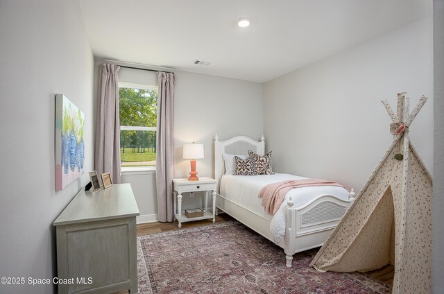 6305 Moonrise Dr, Merritt Island, FL 32953 - bedroom with wood finished floors and recessed lighting