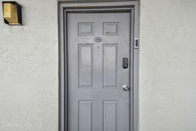 85 S Atlantic Ave Unit 403, Cocoa Beach, FL 32931 - entrance to property featuring stucco siding