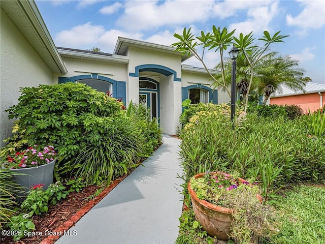 5151 4th Pl, Vero Beach, FL 32968 - view of exterior entry featuring stucco siding