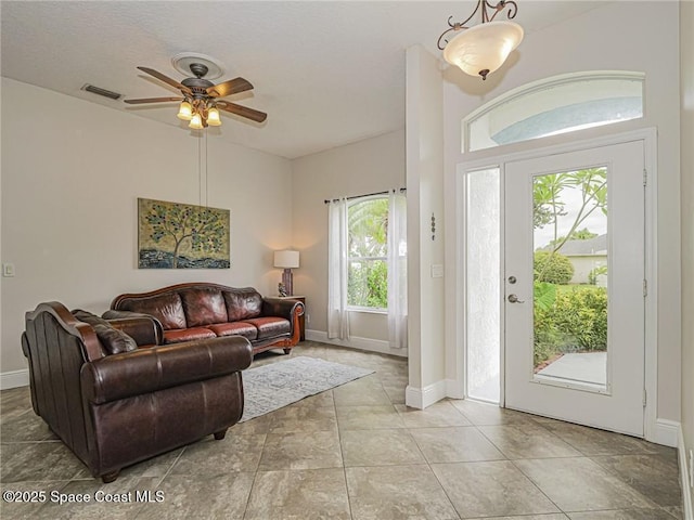 5151 4th Pl, Vero Beach, FL 32968 - living area with ceiling fan and baseboards