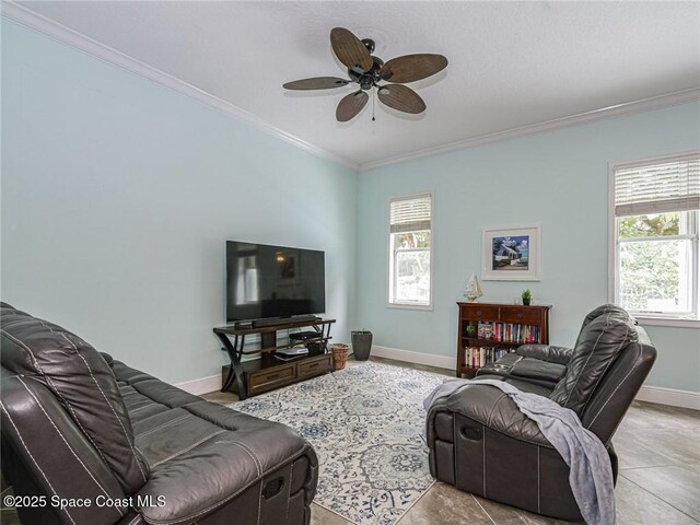 5151 4th Pl, Vero Beach, FL 32968 - living room with ornamental molding, a ceiling fan, plenty of natural light, and baseboards
