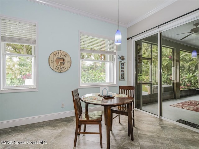 5151 4th Pl, Vero Beach, FL 32968 - dining area featuring a ceiling fan, crown molding, and baseboards