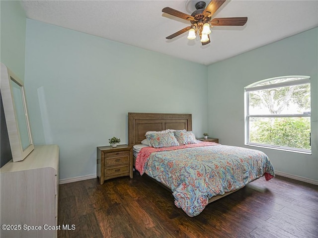 5151 4th Pl, Vero Beach, FL 32968 - bedroom featuring dark wood finished floors, baseboards, and ceiling fan