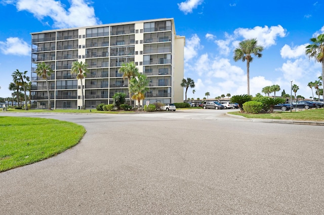 520 Palm Springs Blvd Unit 505, Indian Harbour Beach, FL 32937 - view of apartment building / complex with uncovered parking