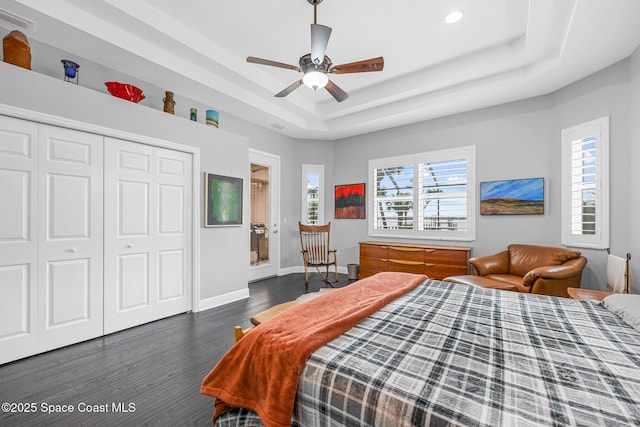 11 Pisces Ln, Rockledge, FL 32955 - bedroom with a tray ceiling, wood finished floors, recessed lighting, a closet, and a ceiling fan