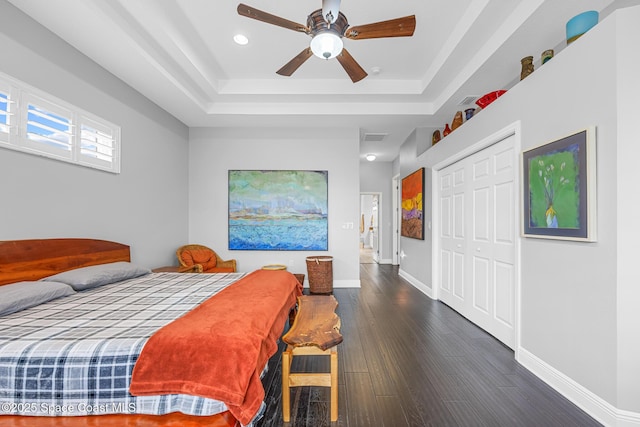 11 Pisces Ln, Rockledge, FL 32955 - bedroom with a raised ceiling, wood finished floors, recessed lighting, a closet, and a ceiling fan
