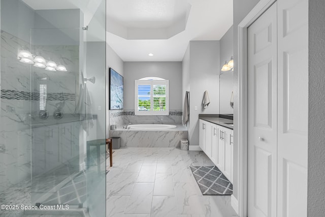 11 Pisces Ln, Rockledge, FL 32955 - bathroom with vanity, a garden tub, a marble finish shower, marble finish flooring, and recessed lighting