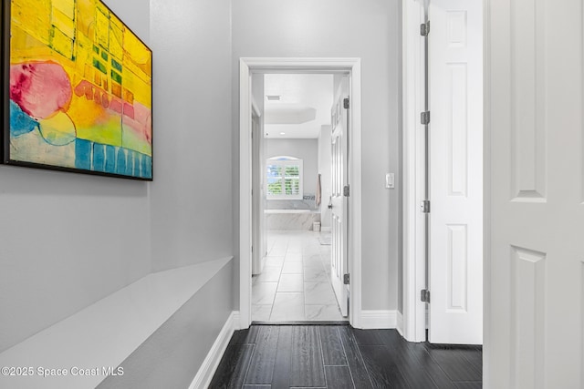 11 Pisces Ln, Rockledge, FL 32955 - corridor with dark marble finish flooring and baseboards