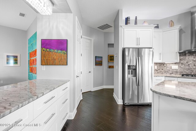 11 Pisces Ln, Rockledge, FL 32955 - kitchen featuring stainless steel appliances, dark wood-style flooring, light stone countertops, tasteful backsplash, and white cabinetry