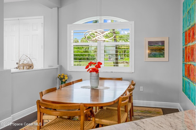 11 Pisces Ln, Rockledge, FL 32955 - dining area featuring baseboards and wood finished floors