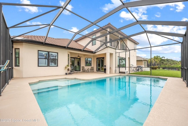 11 Pisces Ln, Rockledge, FL 32955 - swimming pool featuring a patio, ceiling fan, a lanai, and a yard