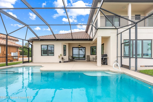 11 Pisces Ln, Rockledge, FL 32955 - rear view of property with stucco siding, a balcony, a patio, and a tile roof
