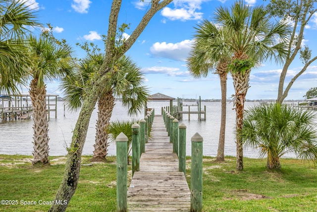 11 Pisces Ln, Rockledge, FL 32955 - dock area with a water view and a yard