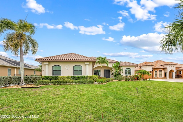 11 Pisces Ln, Rockledge, FL 32955 - mediterranean / spanish-style home with stucco siding, a tile roof, and a front yard