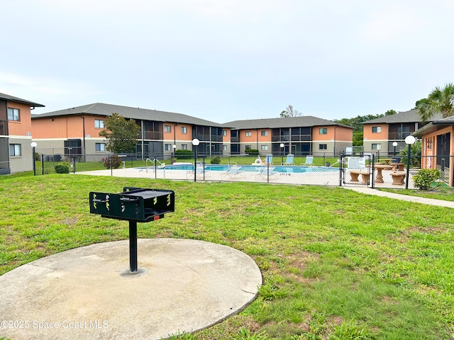 1704 University Ln Unit 703, Cocoa, FL 32922 - view of home's community with a residential view, a pool, and a gate
