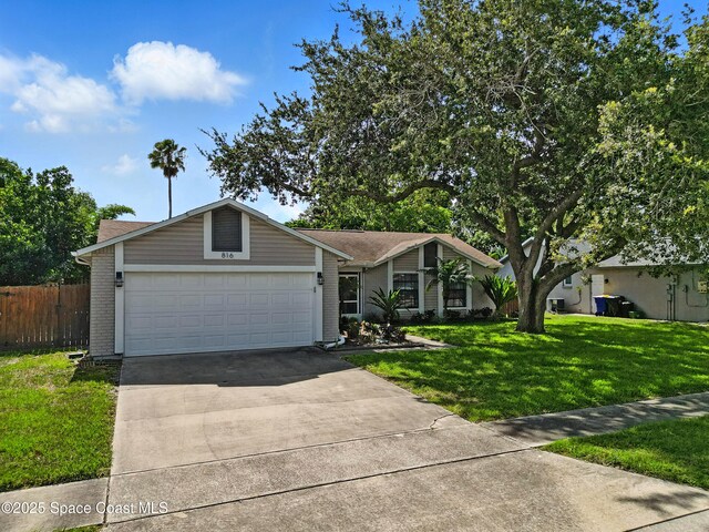 816 Pine Shadows Ave W, Rockledge, FL 32955 - view of front of home with brick siding, a garage, and driveway