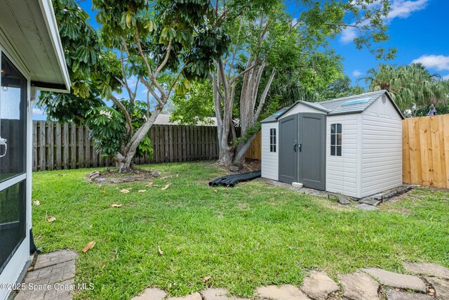 816 Pine Shadows Ave W, Rockledge, FL 32955 - fenced backyard featuring a storage shed