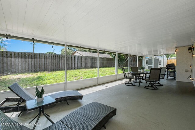 816 Pine Shadows Ave W, Rockledge, FL 32955 - sunroom / solarium with outdoor dining space