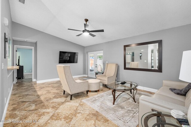 816 Pine Shadows Ave W, Rockledge, FL 32955 - living area with ceiling fan, lofted ceiling, and stone finish floors