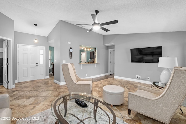 816 Pine Shadows Ave W, Rockledge, FL 32955 - living room with lofted ceiling, a ceiling fan, and a textured ceiling