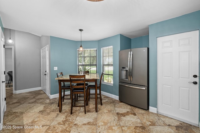 816 Pine Shadows Ave W, Rockledge, FL 32955 - dining area with light stone finish flooring