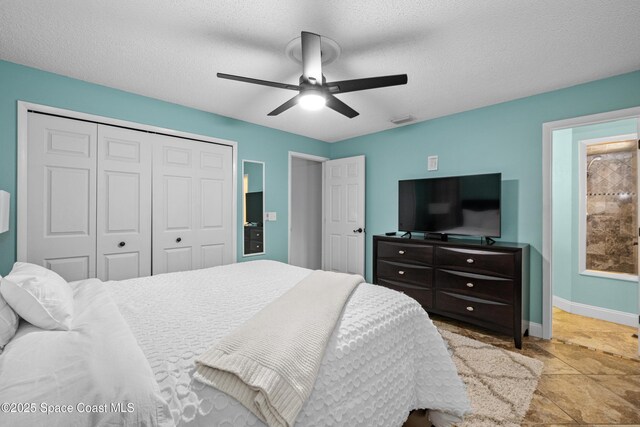 816 Pine Shadows Ave W, Rockledge, FL 32955 - bedroom with a closet, a textured ceiling, and a ceiling fan