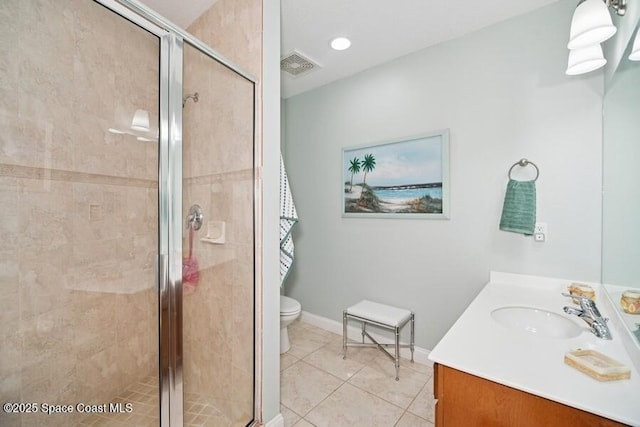 601 N Miramar Ave Unit 314, Indialantic, FL 32903 - full bathroom with vanity, toilet, tile patterned floors, and a shower stall