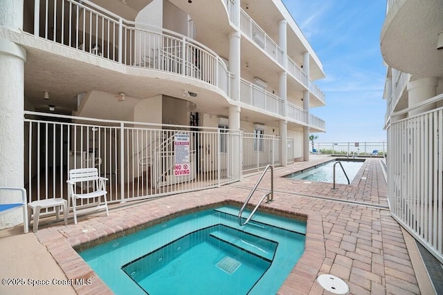 601 N Miramar Ave Unit 314, Indialantic, FL 32903 - community pool featuring a community hot tub and a patio