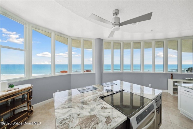 601 N Miramar Ave Unit 314, Indialantic, FL 32903 - sunroom / solarium featuring a water view