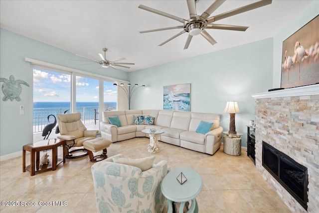 601 N Miramar Ave Unit 314, Indialantic, FL 32903 - living room featuring ceiling fan, light tile patterned flooring, and baseboards