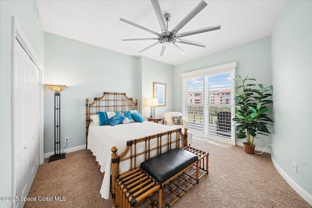 601 N Miramar Ave Unit 314, Indialantic, FL 32903 - carpeted bedroom with baseboards, a ceiling fan, and a closet