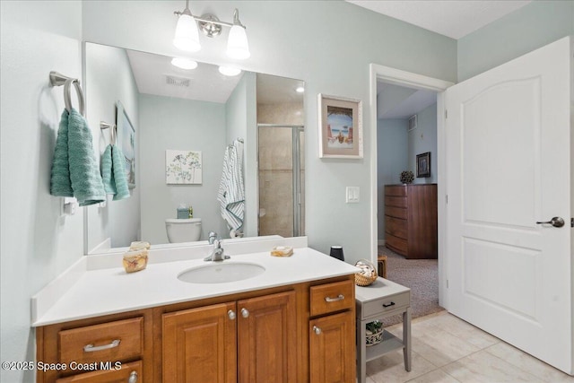 601 N Miramar Ave Unit 314, Indialantic, FL 32903 - full bathroom featuring a shower stall, vanity, tile patterned floors, and toilet