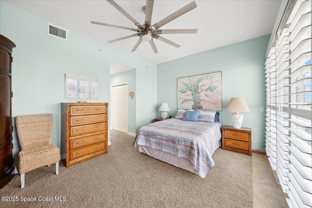 601 N Miramar Ave Unit 314, Indialantic, FL 32903 - bedroom featuring multiple windows, a closet, light colored carpet, and a ceiling fan