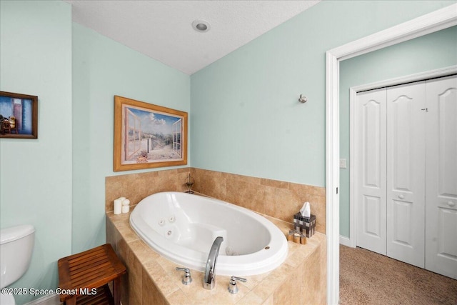 601 N Miramar Ave Unit 314, Indialantic, FL 32903 - full bath with a jetted tub, toilet, and a closet