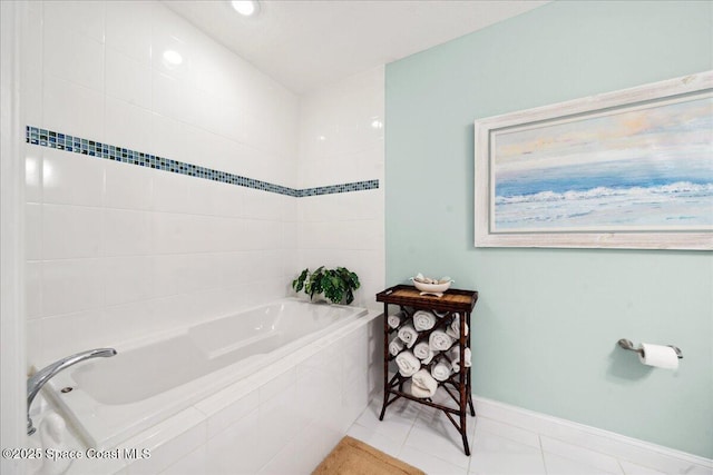601 N Miramar Ave Unit 314, Indialantic, FL 32903 - full bath featuring tiled tub, tile patterned flooring, and baseboards