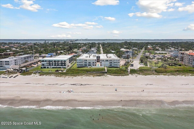 601 N Miramar Ave Unit 314, Indialantic, FL 32903 - bird's eye view of waterfront with a beach