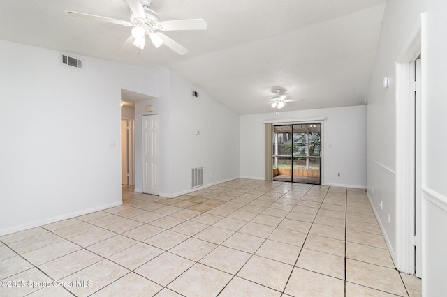 7413 Ester Rd, Cocoa, FL 32927 - unfurnished room with a ceiling fan, vaulted ceiling, and light tile patterned floors
