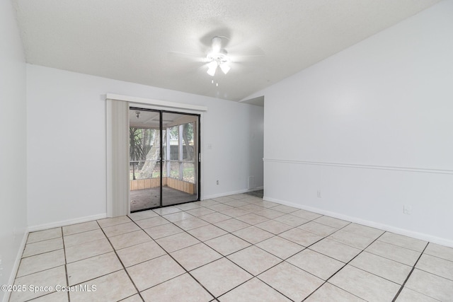 7413 Ester Rd, Cocoa, FL 32927 - spare room featuring ceiling fan, light tile patterned flooring, and a textured ceiling
