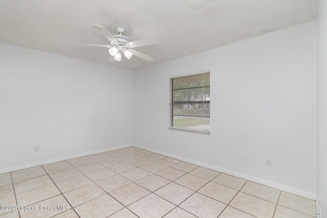 7413 Ester Rd, Cocoa, FL 32927 - empty room featuring ceiling fan, light tile patterned floors, and a textured ceiling