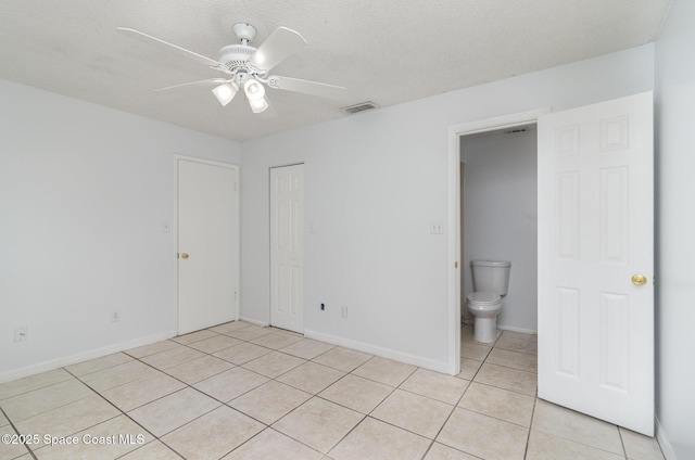 7413 Ester Rd, Cocoa, FL 32927 - unfurnished bedroom with light tile patterned floors, a closet, and ceiling fan