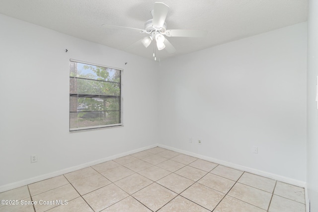 7413 Ester Rd, Cocoa, FL 32927 - empty room featuring light tile patterned floors and ceiling fan