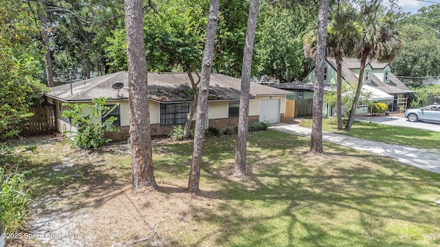7413 Ester Rd, Cocoa, FL 32927 - view of front of home featuring concrete driveway, a garage, and brick siding